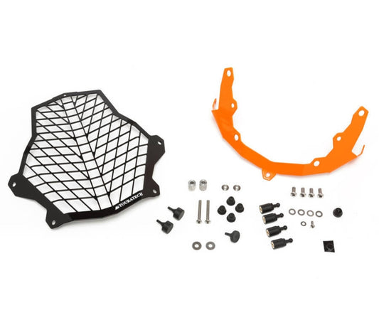 Захисна решітка для фари з нержавіючої сталі чорного/помаранчевого кольору Touratech, для KTM 1050/1090/1190 Adventure R/1290 S Adv *ЛИШЕ ДЛЯ ПОЗАШЛЯХОВОГО ВИКОРИСТАННЯ*